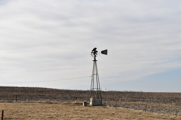 Wall Mural - Windmill in a Farm Field