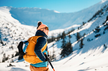 mountaineer backcountry ski walking ski alpinist in the mountains. ski touring in alpine landscape w