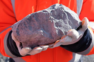 Khabarovsk territory / Russia - 03.22.2018 : Stone from a gold mine in the hands