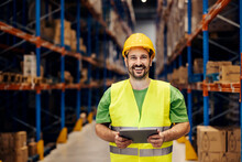 Portrait Of A Happy Warehouse Worker With Tablet In Hands Checking On Order.