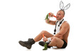 Lovely man in rabbit costume with carrots