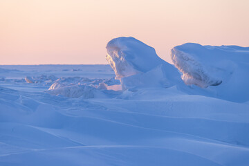 Wall Mural - winter arctic landscape. morning view of large ice hummocks and snowdrifts. snow-covered ice floes o