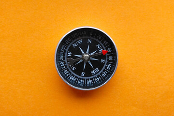 Compass orange background close-up