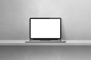 Laptop computer on grey shelf background