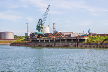 Poster - A crane at a scrapyard in the Cologne harbor industrial area NRW Germany