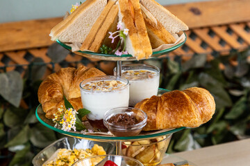 Sticker - Three stage platter with dessert and sandwiches