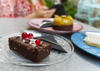 Poster - Closeup of a chocolate bar with coconut flakes and berries on a transparent plate