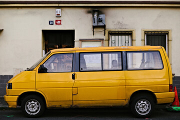 Sticker - Beautiful shot of a yellow car parked on a street during the day