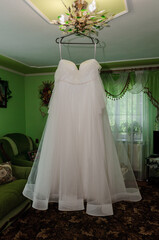 Wall Mural - Wedding dress on a hanger. morning of the bride