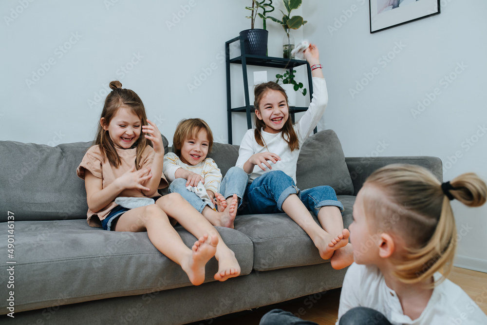 Pooling Socks Young children pulling socks of of themselves and throwing at each ...