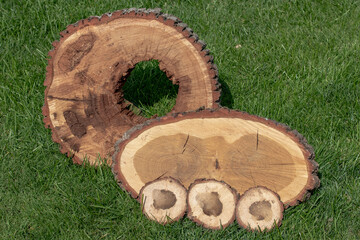 Sticker - Saw-cut pieces of wood on the grass