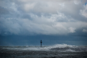 Wall Mural - photo of a heavy storm at the gates to the port of klaipeda, lithuania the baltic sea
