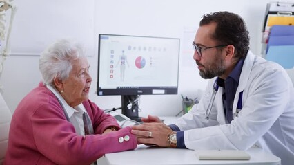 Wall Mural - senior woman on consultation with doctor in his office.