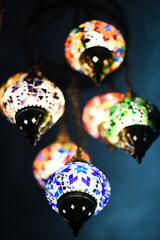 Canvas Print - Vertical of a chandelier of tiny mosaic patterns hanging from a ceiling