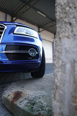 Poster - Vertical shot of a blue car