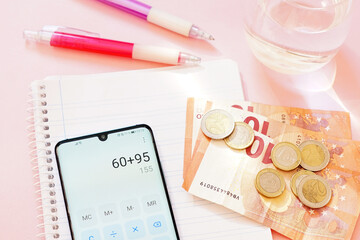 Canvas Print - Pink background with a phone, money and supplies