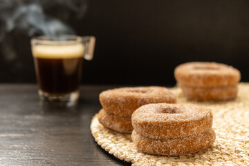 Wall Mural - Close-up shot of sweet cookies with a cup of coffee on the background