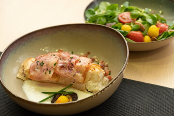 Sticker - Healthy Mediterranean fish dish with garnish and delicious sauce from a Spanish tapas