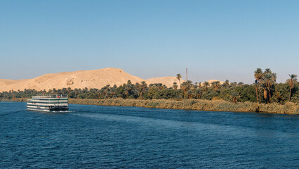 Sticker - of a retro-style cruise boat on a river Nile