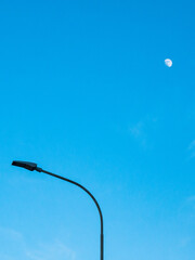Wall Mural - The sky, the moon and a light pole.
