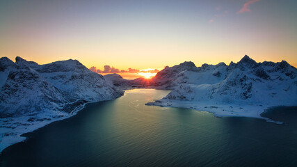 Poster - Beautiful view of snowy mountains and icy shores of the Lofoten Islands at sunset, Norway