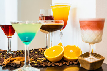 Wall Mural - Bunch of different gourmet cocktails on a bar table with coffee beans