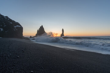 Wall Mural - scenic view of a black-sand beach during sunset in reynisfjara, iceland