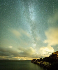 Wall Mural - milky way in the charming night sky over stege, denmark