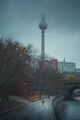 Wall Mural - Vertical shot of Berlin TV tower in Germany during a foggy morning