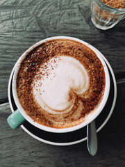 Canvas Print - Vertical closeup shot of a latte with foam art