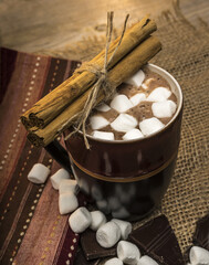 Wall Mural - Vertical shot of a cup of hot chocolate with marshmallows