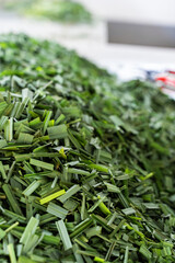 Wall Mural - Vertical shot of freshly chopped lemongrass on the table in Tena, Ecuador