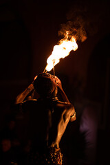 Poster - Back shot of a performer Moroccan fire breather, in Marrakech at night