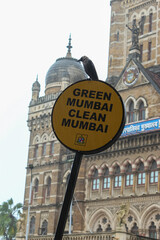 Wall Mural - Vertical shot of the street sign against Municipal Corporation of Greater Mumbai.