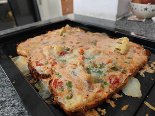 Canvas Print - Slices of double roti bread filled with vegetables and cheese