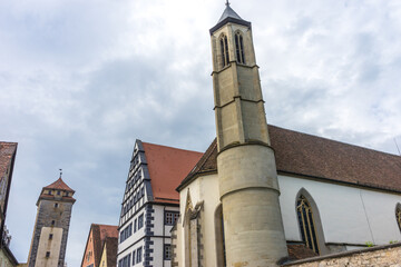 Sticker - Vertical shot of the church of Rothenburg ob der Tauber against a cloudy sky