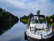 Yacht on the Trent-Severn Waterway surrounded by greenery in Canada