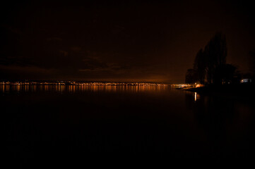 Wall Mural - Beautiful night view of the Lake Constance with long exposure, lights and reflection