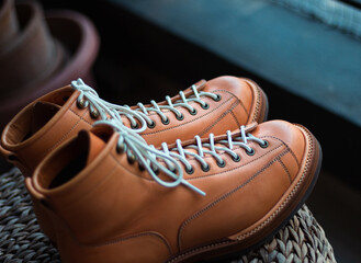 Sticker - Closeup of men's brown shoes on a blurred background