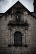 © Eemr/Wirestock - Vertical shot of an old stone building with an arch window