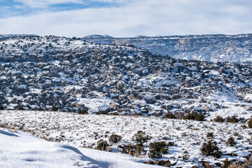 Wall Mural - Natural landscape of a mountain covered in snow