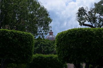 Wall Mural - View of the dome of a cathedral from a garden