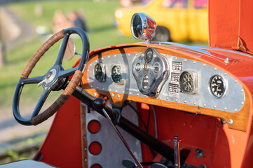 Poster - View of a vintage car's dashboard in sunlight