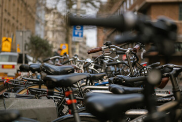 Sticker - Selective focus shot of bicycles parked along the street