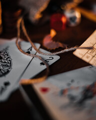 Wall Mural - Closeup shot of playing card and game dices on the wooden surface in the sunlight