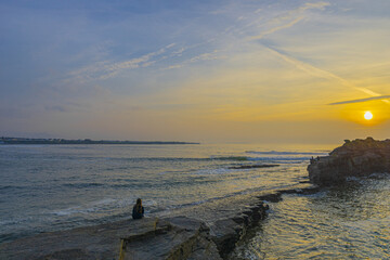 Wall Mural - scenic view of a vast ocean during a bright sunset