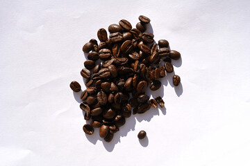 Sticker - Closeup of coffee beans on a white table