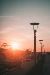 Wall Mural - Vertical shot of street lights at susnet