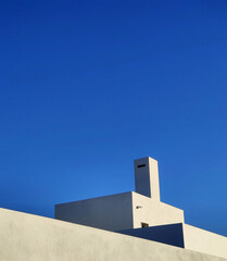 Sticker - Roof of a modern building with blue sky on the background