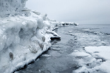 Sticker - Closeup of a snowy beach at winter